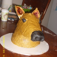 Deer I used 2 round cakes and a football shaped cake. I carved all to make neck and head. the head is on covered board. supported by wooden...