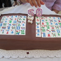 Mahjong Cake Chocolate Fondant w/ chocolate buttercream filling. Family put the "50" candle so she had something to blow out :)