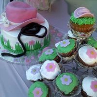 Pink Cowgirl Hat Cake2 I want to add the matching cupcakes to the picture section. The cupcakes are white chocolate cake with white chocolate chips, iced with...