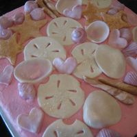 Seashell Cake gumpaste seashells on buttercream frosted cake