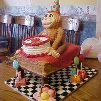 Curious George On Table Getting Cake This is the first 3-D cake I have attempted. The idea came to me after watching a cake challenge. George is made of spice cake and carved...