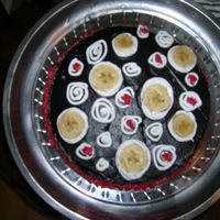 Just Having Fun banana cake with swirly decoration, banana slices for added touch. all buttercream.