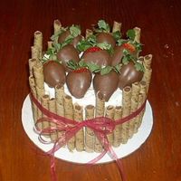 Chocolate Covered Strawberries - Chocolate Cake. Inspiration from someone on C.C. Thank you so much for all of the great ideas This cake has chocolate mocha pirouette cookies around the...