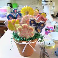 First Cookie Bouquet First cookie bouquet ever. NFSC cookies, sugar glaze recipe off Allrecipes.com and colored with wilton color pastes. The extra green hangy...