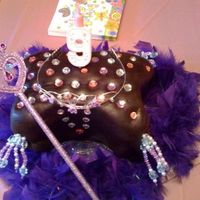 First Pillow Cake Birthday cake for my niece. Chocolate Cake with Chocolate Buttercream icing covered in chocolate fondant. Found the gems at hobby lobby....