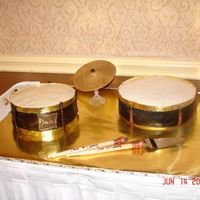 Drum Cake My first paid cake! Double chocolate cake w/chocolate buttercream icing. Covered in fondant then covered the top w/vanilla icing. Gold...