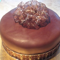 Chocolate And Gold Birthday Cake I made this for the birthday of a close friend. It's a Wellesley Chocolate fudge cake filled with ganache and covered with chocolate...