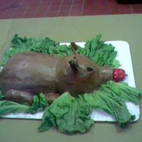 Roasted Pig Yellow cake chc. B/C glazed with corn syrup (that you can't see in the picture) ears are MMF. Forgot his tail oooppps...My batteries...