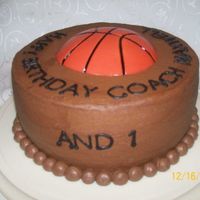And 1 Simple 2-layer 9" with chocolate icing. B-ball is MMF; mixed brown, super red, and yellow to achieve b-ball color. Made line indents...