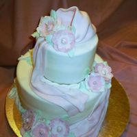 Draped In Pink Those who have taken the Wilton Fondant Class will recognize this one. All fondant. Pearl stamens. This would make a pretty Mother's...