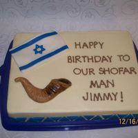 Shofar Man Plain 1/4 sheet buttercream. Israeli flag, shofar, and triangle border made from marshmallow fondant. Shofar tinted with brown before...