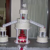 Stairway To Love Whole lot of cake, lol. All yellow cake frosted in b/c, decorated with royal icing, and silver luster dust.