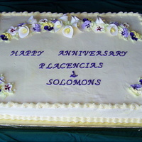 Calla Lilies And Pansies Anniversary Cake This is a large cake - two 12x18 cakes side-by-side. Calla Lilies and Pansies in the floral spray. Vanilla buttercream, yellow cake with...