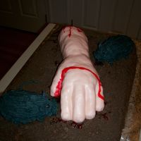 Severed Arm With Rats Cake Full size chocolate sheet cake with chocolate buttercream icing and crushed chocolate graham crackers for dirt, severed arm modeled out of...