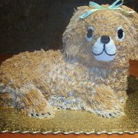 Puppy Dog Cake Puppy dog birthday cake decorated in buttercream with ribbon bow.