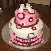 Kendall's Baby Shower Cake Cake covered in marshmellow chocolate fondant and fondant decorations