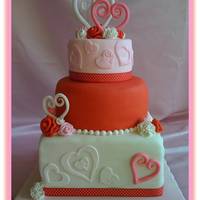 Hearts And Flowers I made this cake for a bridal shower. The smallest cake is a dummy. Square cake is 10 in., red round cake is 8 in. The bride wanted red,...