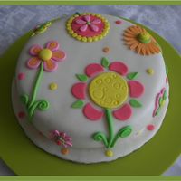 Fantasy Flowers Cake 9 inch carrot cake covered with MMF. All flowers are fondant. I took this idea from one of Lindy Smith&acute;s books. The client told...