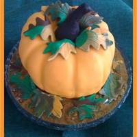 Pumpkin Cake Vanilla cake covered with fondant..
