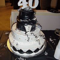 40Th Birthday Top Hat and Tuxedo cake from Fondant and Butter Cream icing with silver dragees.