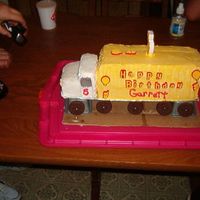 Garrett's Rig I used 2 quarter sheets and a coffee can (for the cab) ,covered it in buttercream icing. Its a chocolate trailer and yellow cab. The wheels...