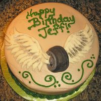 Flying Wheels This was made for a Sheriffs deputy who is a Motorcycle cop. He designed this logo for the department. BC with fondant accents