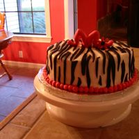 Zebra For Madeline I got this idea from another cake on this website. It was fun to do for my daughters friend. The topper is supposed to be an "m"...