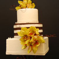 Mixed Shapes Chocolate and vanilla fondant with silk orchids. Thanks for looking!