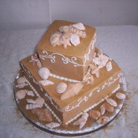 Destination Wedding By The Beach Buttercream cover and vanilla cake. Gumpaste seashells and browm sugar to simulate sand.
