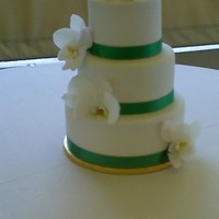 Destination Wedding El San Juan Hotel This cake was made for a destination wedding. Vanilla fondant, fresh orchid, one tier is amaretto and the rest vanilla. Thanks for looking...