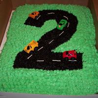 Number Two Race Track A double chocolate chip cake with in which I turned the number two into a race track. I used black sugars for the two, piped white icing on...