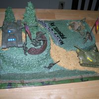 Camo Cake Iced in buttercream with buttercream accents. Inside of the cake is also camoflauge.