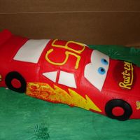 Lightning Mcqueen car formed with rice krispy treats and then covered with fondant.