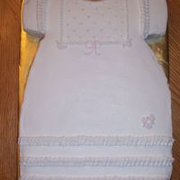 Girl Baby Shower 9x13 cake carved to look like a little girl's dress. I used a drinking glass as a guide to cut out the neckline. Then I carved the...