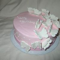 Butterfly Cake Triple layer chocolate cake with buttercream filling and icing. Fondant butterflies.