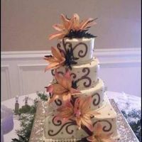 Kelly this is beige buttercream w/ chocolate scrolls and fresh flowers thanks for looking!