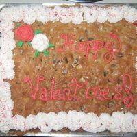 Valentine's Chocolate Chunk Cookie Cake The Chocolate Chunk cookie cake I made for my husband, and don't laugh at my roses.. it was my first attempt! :)