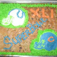 Large Super Bowl Chocolate Chip Cookie My husband doesn't like cake so I made him a cookie! My first giant cookie, and 3rd decorating experience. I gave the buttercream...