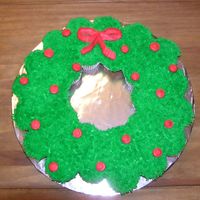 Wreath Cupcake Cake This is a cupcake cake I did for my husband to take to his co-workers for the holidays.