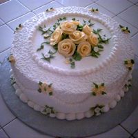 For A Special Friend This was done for a special friend who likes yellow roses... Is all buttercream icing on white cake with custard filling.