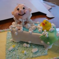 Rub A Dub Baby In Tub Baby shower cake. Rice krispie and fondant baby. Pound cake bathtub. Bubbles out of frosting.
