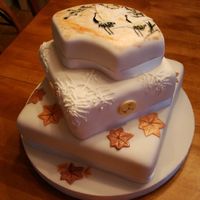 Japanese Wedding Cake Two cranes,Pine, Tibetan wedding knot x4, maple leaves. The client wanted all of these elements, with some fall colors and simple white....