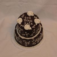 Chocolate And White Chocolate ganache frosting with BC flowers and scrolls