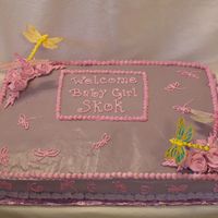 Dragonfly Cassata Cake Cassata cake with SMBC on top and Bettercream on sides. Dragonflies are rice paper with royal icing bodies. Flowers are Bettercream.