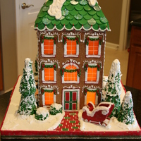 Traditional Gingerbread House This is my first from scratch gingerbread house. It is 18" tall. Completely edible. Candy clay roof shingles, butterscotch windows,...