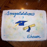 Graduation Cake This was a graduation cake that was made for a friend. It is a half sheet cake (half white/half chocolate). The cap and diploma are color...