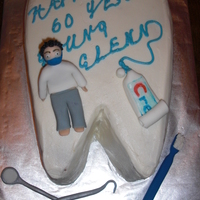 60 Years Young vanilla cake for a dentist's b-day. Covered in BC with fondant accents. thanks for looking!