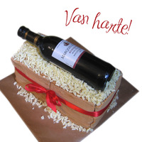 Wine Lover! got a wine cake..The cake is the bottem wooden box, with a mini real winebottle(filled) on top!