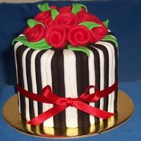 Gift Cake A minature version of the engagement cake in my photos. Sides are straight this time. Black and white stripes, red ribobn roses. 3.5inch...