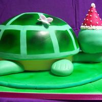 Turtle Birthday Cake 2 Of 2 Chocolate cake with strawberry buttercream for a girls 5th birthday. Cake baked in a metal bowl. Shell, head and present are cake, rest is...